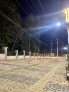 an empty parking lot at night with a street light at Guest house in Hārer