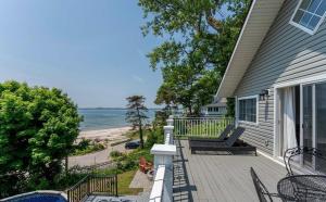 a porch of a house with a view of the beach at Waterfront Cottage w Pool Beach Access in Fort Erie