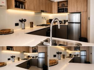 a kitchen with white countertops and a sink at House Vista Azul in Puerto Madryn