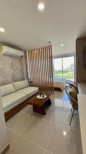 a living room with a couch and a bed at Ola del Mar in Gaira
