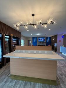 a waiting room with a counter in a store at La Quinta by Wyndham Morgan City in Morgan City