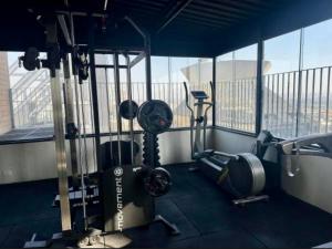 a gym with two treadmills and two exercise bikes at Hotel Sol Alphaville1505 in Barueri