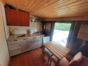 a small kitchen with a table and a sink at Fantasy in Karlovy Vary