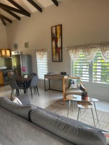 a living room with a couch and a table at B's Hidden Paradise in Philipsburg