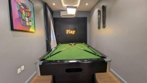 a game room with a pool table in it at 4 Bedroom duplex in Orchid in Lekki