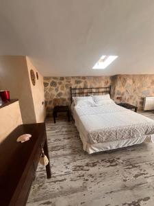 a bedroom with a large bed in a room at La Casa Los Patios in Mahora +38 photos
