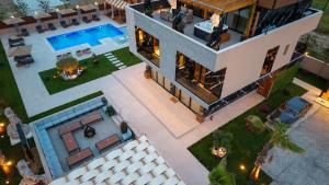 an aerial view of a house with a swimming pool at HH Point Luxury Villas in Durrës