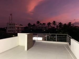 a view of a building from a balcony at night at Casa de la Playa in Playa Azul