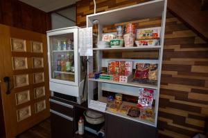 a refrigerator with its door open and food inside at 暮泊くらはく 1日 1組様限定 5名様まで宿泊可能 in Mikasa +36 photos