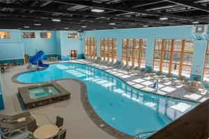 a large swimming pool with chairs around it at LakeSides Retreat with Amenities in Hollister