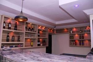 a bar with lots of bottles of wine at MF Supreme Hotels and suites in Ikorodu