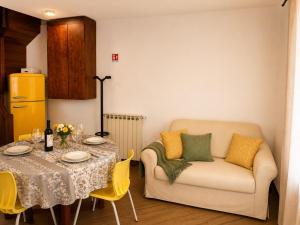 a living room with a table and a couch at Ca' Santa Maria in Santa Maria Maggiore
