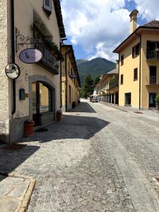 a cobblestone street in a town with buildings at Ca' Santa Maria in Santa Maria Maggiore