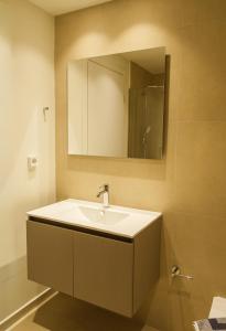 a bathroom with a sink and a mirror at Villa Artemis 2 - Etheras Properties in Kythira +51 photos