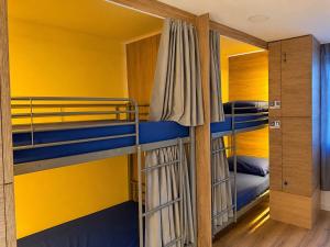 a bunk bed room with two bunk beds at CH Arzúa Pilgrim Hostel in Arzúa