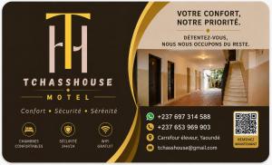 a sign for a hotel with a building at TCHASSHOUSE Motel in Yaoundé