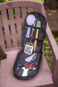 a bag of utensils sitting on a park bench at Wanagiri Reserve in Gitgit