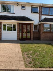 a brick house with a front door at Cosy in Windsor in Windsor