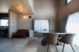 a dining room with a table and chairs at plus81 OTARU Entire House 9min Walk from Minami Otaru Station in Otaru