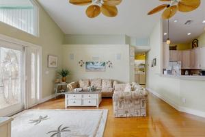 a living room with a couch and a table at Diversity in Saint James City