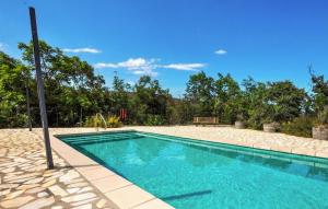 a swimming pool in the middle of a yard at Imprenable Villa Piscine in Taulis +15 photos