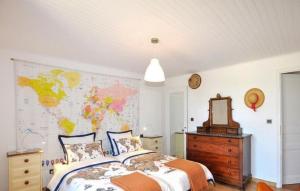 a bedroom with a bed and a map on the wall at Imprenable Villa Piscine in Taulis