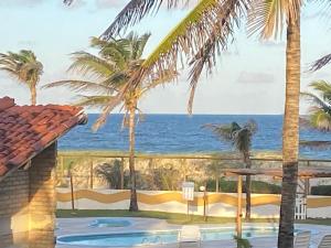 a view of the ocean from a resort at Resort felicidade in Extremóz