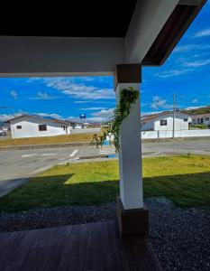 a porch with a white column with a plant at Cozy Calm Refuge in Alto Boquete