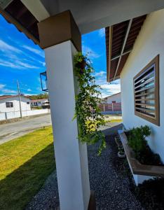 a pillar of a house with a plant on it at Cozy Calm Refuge in Alto Boquete