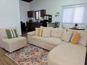 a living room with a couch and two chairs at Cozy Calm Refuge in Alto Boquete