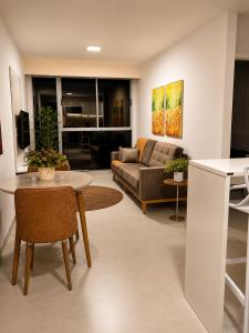 a living room with a couch and a table at Life Center in Caruaru