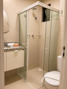a bathroom with a shower and a toilet at Life Center in Caruaru +2 photos