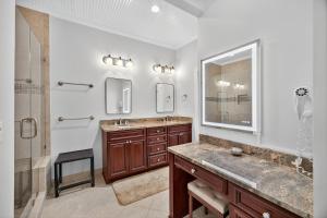 a bathroom with two sinks and a large mirror at SS3512: 3512 Seascape in Kiawah Island +38 photos