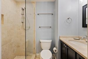a bathroom with a shower and a toilet and a sink at SS3510: 3510 Seascape in Kiawah Island +20 photos