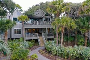 a large house with palm trees in front of it at SS3510: 3510 Seascape in Kiawah Island