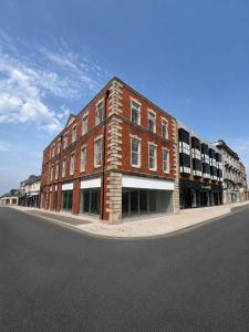 a large brick building on the side of a street at Studio 4 in Portadown