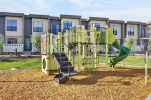 a playground with a slide in front of a building at Sonoran Oasis with Pool, Spa & BBQ Area in Phoenix