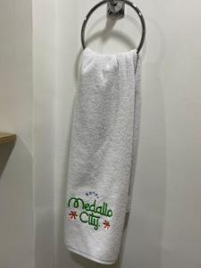 a towel is hanging on a door hook at Hotel Medallo City in Medellín