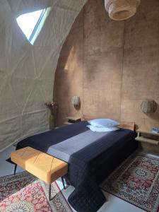a bedroom with a bed in a tent at Mullimaja in Treimani