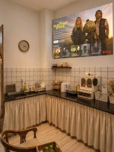 a kitchen with a counter top with at LàMin Homestay in Ấp Long Ðại