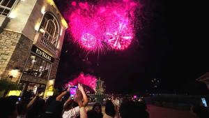 a crowd of people taking pictures of fireworks at Diamond Suite The Hill Phu Quoc in Phú Quốc +109 photos