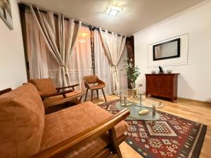 a living room with a couch and a table at Departamentos Innova in Copiapó