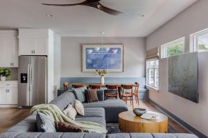 a living room with a couch and a table at Expansive Luxury Escape with Private Pool in Austin