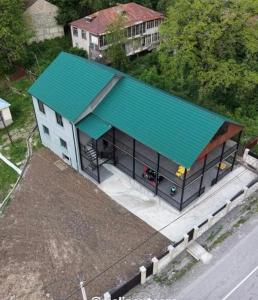 an overhead view of a building with a green roof at Malina Utsera in Oni