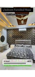a poster of a bedroom with a bed in a room at Behria town phase 8 in Rawalpindi