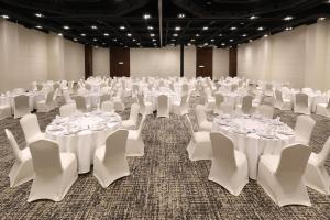 a large room with white tables and white chairs at Holiday Inn Mexico Zona Centro by IHG in Mexico City +98 photos