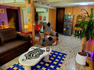 a living room with a couch and a chair at LowKey Villa - Quiet Jungle Beach Escape in Ko Kood +37 photos