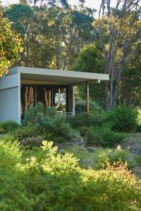 a small house in the middle of a garden at Eight Willows Retreat in Margaret River Town