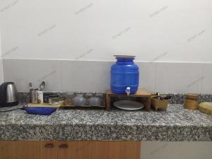 a blue vase sitting on top of a counter at Viki homestay in Dimapur +2 photos