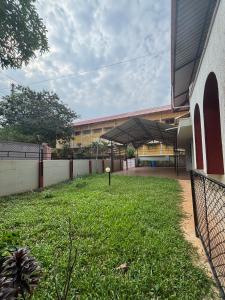 a school yard with a tennis ball in the grass at 3bhk villa in Lalbagh in Mangalore